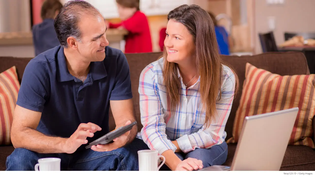 hispanic family paying bills